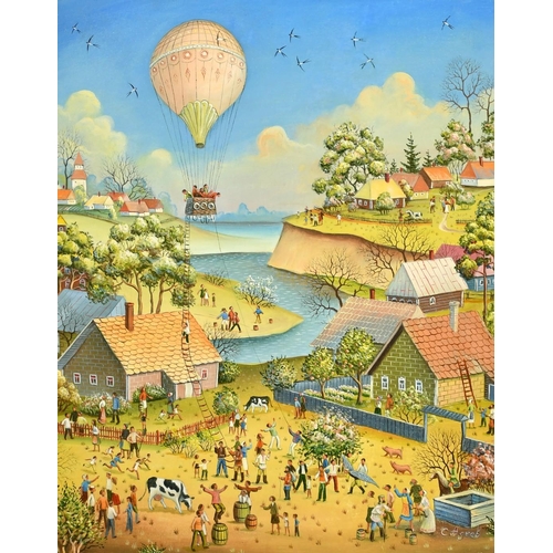 2577 - Dina Eltseva (b. 1965), a balloon flying above a fantastical town, oil on canvas, signed, 16