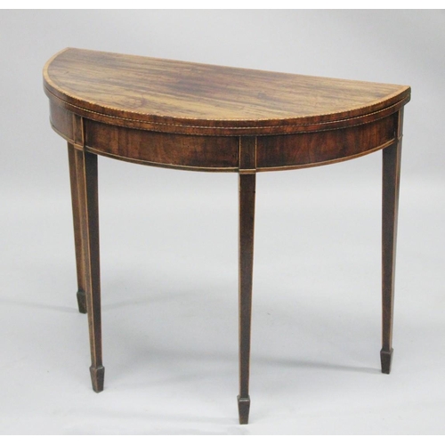 1002 - A GOOD GEORGE III MAHOGANY DEMI-LUNE FOLD OVER CARD TABLE with tapering legs. 2ft 6ins high x 3ft wi... 