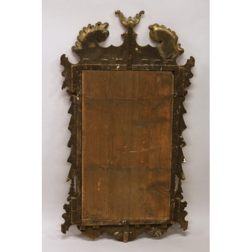 1003 - A GOOD GEORGE III DESIGN CARVED WOOD AND GILDED MIRROR with acanthus scrolls, masks, and urns. 3ft 1... 