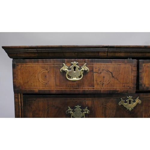 1005 - AN EARLY 17TH CENTURY CHEST ON STAND with a moulded cornice above two short and three graduated long... 