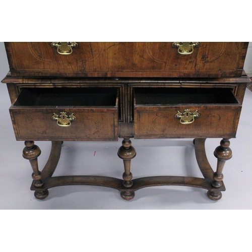 1005 - AN EARLY 17TH CENTURY CHEST ON STAND with a moulded cornice above two short and three graduated long... 