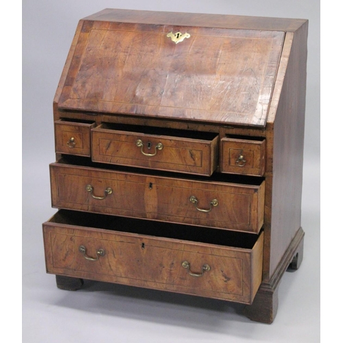 1006 - AN 18TH CENTURY WALNUT FALL FRONT BUREAU with a fitted interior, three small drawers above two gradu... 