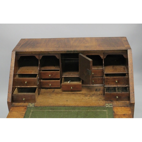 1006 - AN 18TH CENTURY WALNUT FALL FRONT BUREAU with a fitted interior, three small drawers above two gradu... 