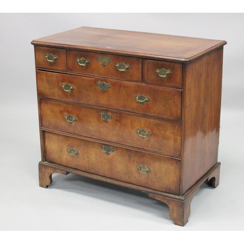 1007 - AN 18TH CENTURY WALNUT CHEST OF DRAWERS with a moulded top, three small drawers above three graduate... 