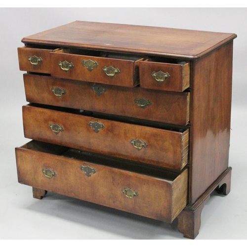 1007 - AN 18TH CENTURY WALNUT CHEST OF DRAWERS with a moulded top, three small drawers above three graduate... 