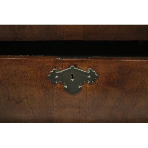 1007 - AN 18TH CENTURY WALNUT CHEST OF DRAWERS with a moulded top, three small drawers above three graduate... 