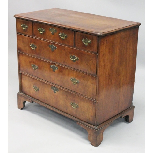 1007 - AN 18TH CENTURY WALNUT CHEST OF DRAWERS with a moulded top, three small drawers above three graduate... 