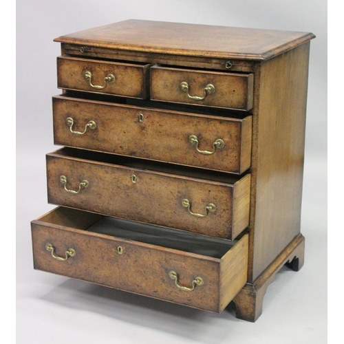 1009 - A GOOD 18TH CENTURY STYLE WALNUT CHEST OF DRAWERS with a moulded top, brushing slide, two short and ... 