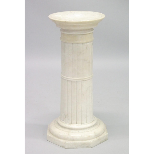 1020 - A MARBLE COLUMN with circular top and octagonal base 27ins high.