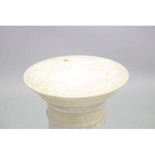 1020 - A MARBLE COLUMN with circular top and octagonal base 27ins high.