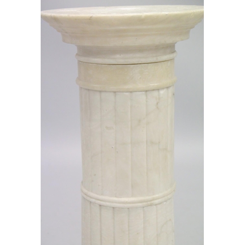 1020 - A MARBLE COLUMN with circular top and octagonal base 27ins high.