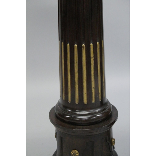 1021 - A GOOD PAIR OF 19TH CENTURY AESTHETIC MAHOGANY STANDS with circular tops gilded fluted column on thr... 