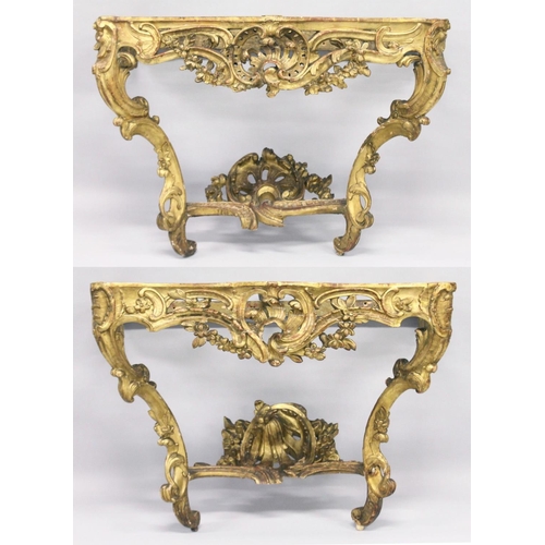 1026 - A VERY GOOD NEAR PAIR OF 18TH CENTURY CARVED AND GILDED CONSOLE TABLES with serpentine marble tops. ... 