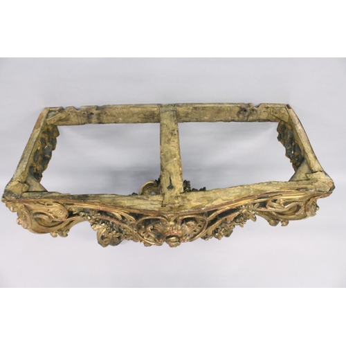 1026 - A VERY GOOD NEAR PAIR OF 18TH CENTURY CARVED AND GILDED CONSOLE TABLES with serpentine marble tops. ... 