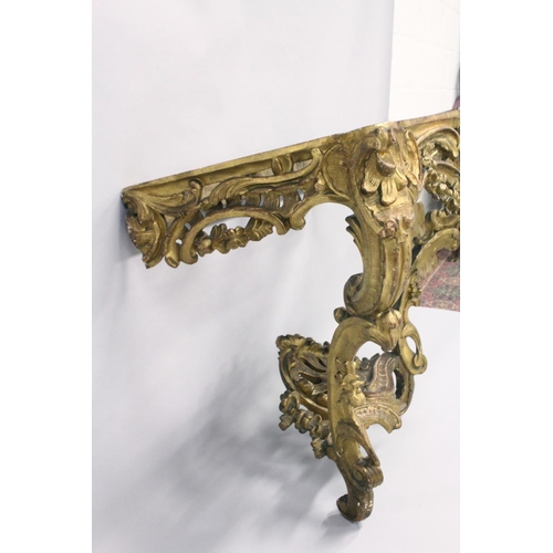 1026 - A VERY GOOD NEAR PAIR OF 18TH CENTURY CARVED AND GILDED CONSOLE TABLES with serpentine marble tops. ... 