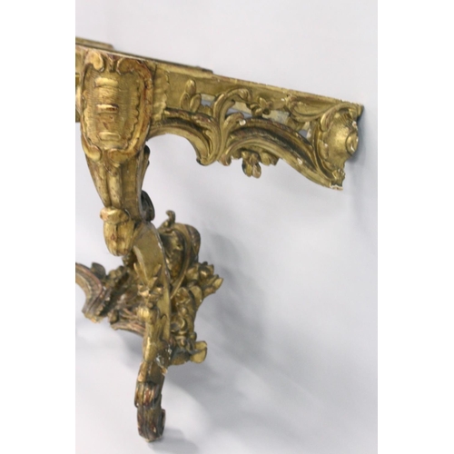 1026 - A VERY GOOD NEAR PAIR OF 18TH CENTURY CARVED AND GILDED CONSOLE TABLES with serpentine marble tops. ... 