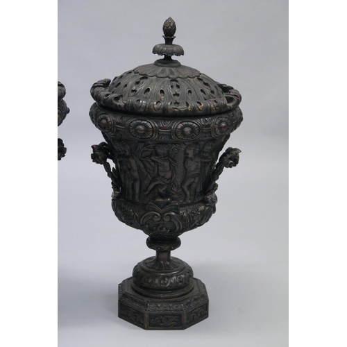 1046 - A GOOD PAIR OF CLASSICAL STYLE CARVED WOOD TWIN HANDLED PEDESTAL URNS. 2ft 10ins high.