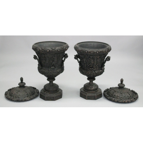 1046 - A GOOD PAIR OF CLASSICAL STYLE CARVED WOOD TWIN HANDLED PEDESTAL URNS. 2ft 10ins high.