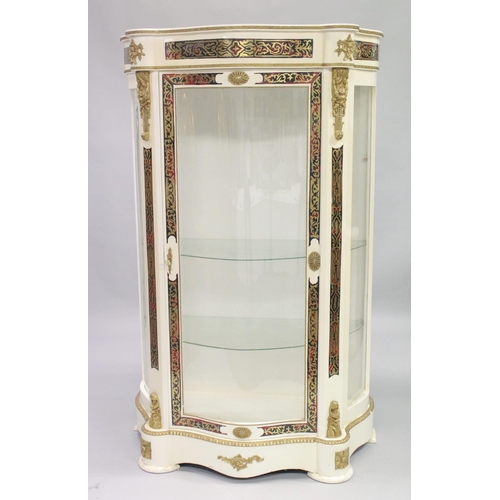 1052 - A FRENCH STYLE WHITE PAINTED STANDING DISPLAY CABINET of 'Serpentine outline inset with 