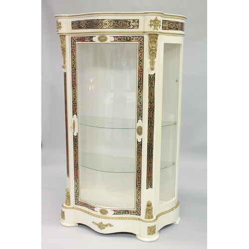 1052 - A FRENCH STYLE WHITE PAINTED STANDING DISPLAY CABINET of 'Serpentine outline inset with 