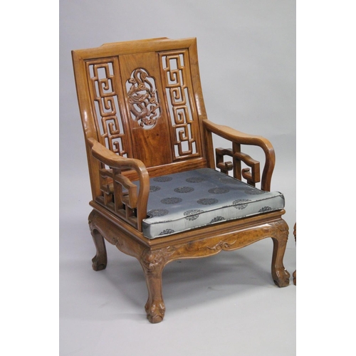 1056 - A PAIR OF CHINESE CARVED REDWOOD ARMCHAIRS.