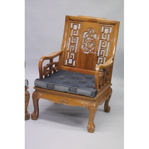 1056 - A PAIR OF CHINESE CARVED REDWOOD ARMCHAIRS.