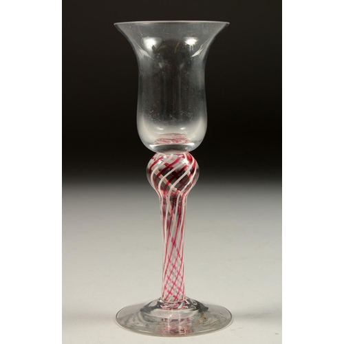 1081 - A GEORGIAN WINE GLASS with inverted bell bowl and column stem. 6.25ins high.