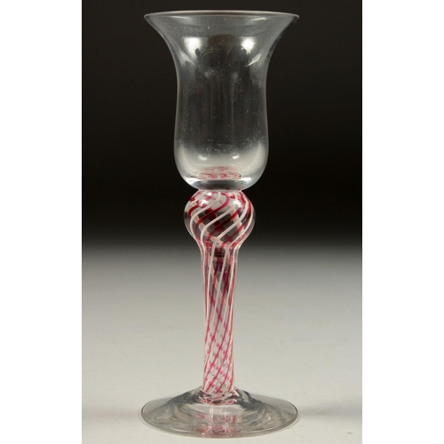 1081 - A GEORGIAN WINE GLASS with inverted bell bowl and column stem. 6.25ins high.