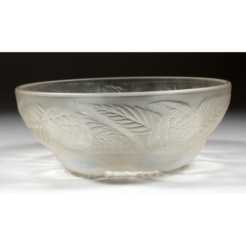 1085 - A LALIQUE CIRCULAR BOWL with flowers in iridescent blue. 9ins diameter. Mark R. LALIQUE, FRANCE.