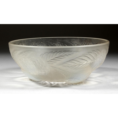 1085 - A LALIQUE CIRCULAR BOWL with flowers in iridescent blue. 9ins diameter. Mark R. LALIQUE, FRANCE.