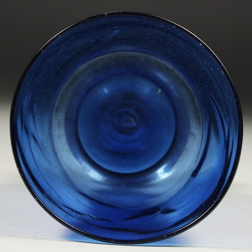 1090 - AN OLD BLUE GLASS VASE. 5.5ins high.