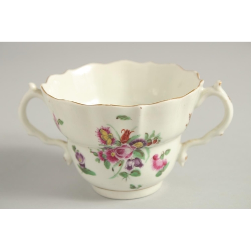 1101 - AN 18TH CENTURY WORCESTER POLYCHROME CHOCOLATE CUP AND SAUCER painted with sprays and sprigs of flow... 