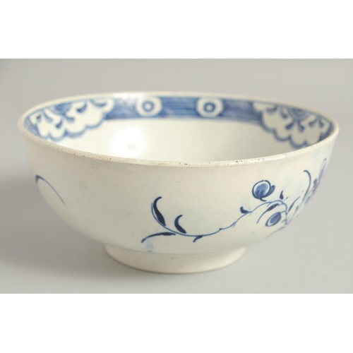 1111 - AN 18TH CENTURY WORCESTER BOWL painted with the uncommon Late Rock Floral pattern, crescent mark.