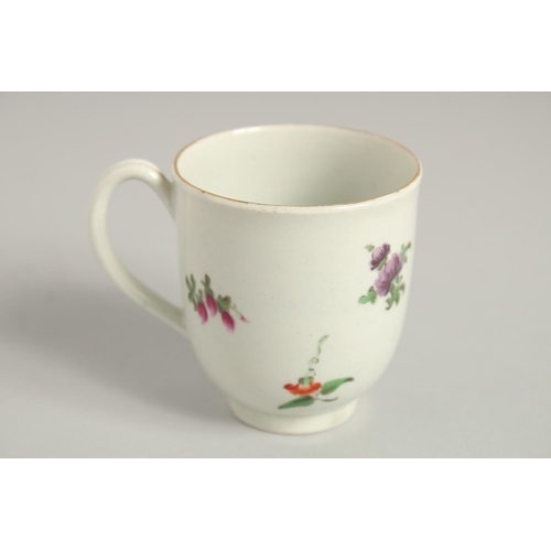 1123 - TWO 18TH CENTURY WORCESTER COFFEE CUPS, one painted with a large bouquet of flowers. scattered with ... 