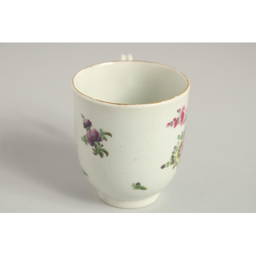 1123 - TWO 18TH CENTURY WORCESTER COFFEE CUPS, one painted with a large bouquet of flowers. scattered with ... 