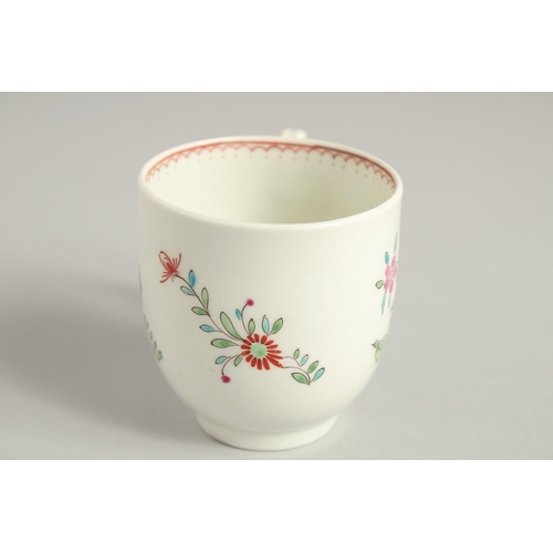 1123 - TWO 18TH CENTURY WORCESTER COFFEE CUPS, one painted with a large bouquet of flowers. scattered with ... 