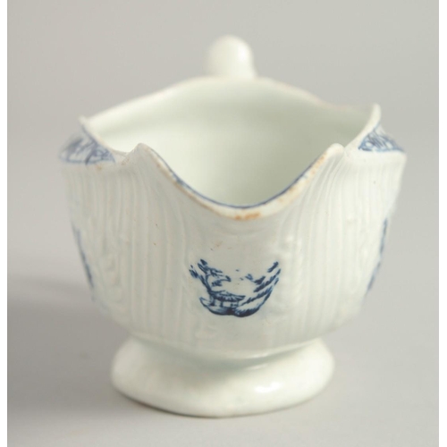 1138 - AN 18TH CENTURY LOWESTOFT FINE SMALL SAUCE BOAT with a pleat moulded body and moulded cartouches pri... 