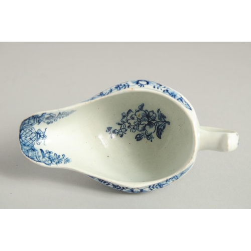 1138 - AN 18TH CENTURY LOWESTOFT FINE SMALL SAUCE BOAT with a pleat moulded body and moulded cartouches pri... 