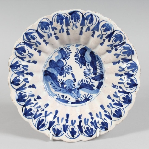 1153 - A 19TH CENTURY BLUE AND WHITE DEEP CHARGER with Chinese design. 10ins diameter.