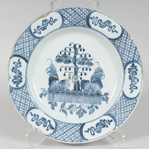 1154 - AN 18TH CENTURY BLUE AND WHITE TIN GLAZE CHARGER (A/F). 12ins diameter.