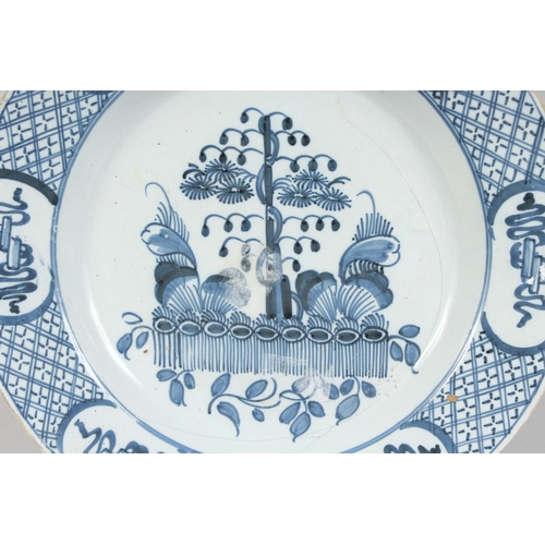 1154 - AN 18TH CENTURY BLUE AND WHITE TIN GLAZE CHARGER (A/F). 12ins diameter.