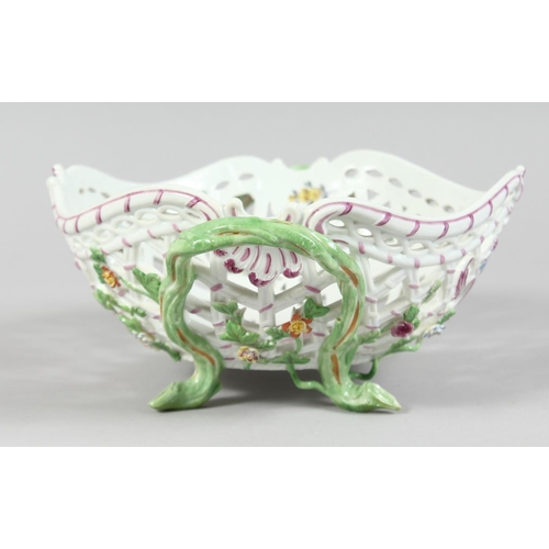 1160 - A GOOD MEISSEN PIERCED TWO HANDLED BASKET painted and encrusted with flowers. Cross swords mark in b... 