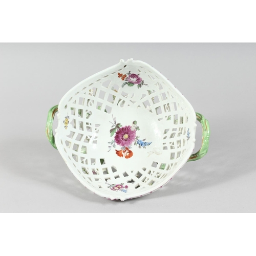 1160 - A GOOD MEISSEN PIERCED TWO HANDLED BASKET painted and encrusted with flowers. Cross swords mark in b... 