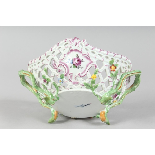 1160 - A GOOD MEISSEN PIERCED TWO HANDLED BASKET painted and encrusted with flowers. Cross swords mark in b... 