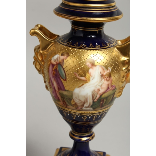 1170 - A SUPERB PAIR OF 19TH CENTURY VIENNA URNS VASES, COVERS AND STANDS, rich blue ground decorated in gi... 