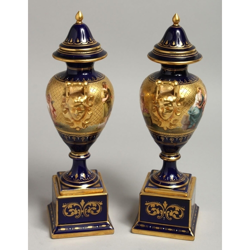 1170 - A SUPERB PAIR OF 19TH CENTURY VIENNA URNS VASES, COVERS AND STANDS, rich blue ground decorated in gi... 