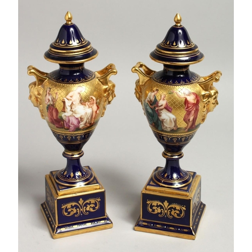 1170 - A SUPERB PAIR OF 19TH CENTURY VIENNA URNS VASES, COVERS AND STANDS, rich blue ground decorated in gi... 