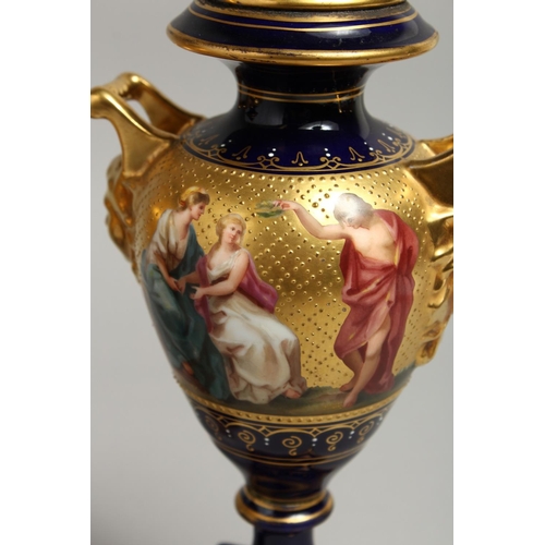 1170 - A SUPERB PAIR OF 19TH CENTURY VIENNA URNS VASES, COVERS AND STANDS, rich blue ground decorated in gi... 