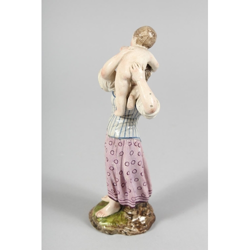 1176 - A GOOD HOSCH FIGURE of a woman holding a baby. Wheel mark, No. 157/ 8.5ins high.