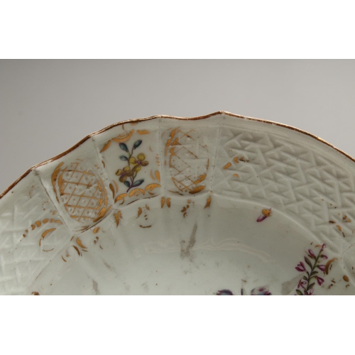 1195 - A MEISSEN PLATE painted with flowers. Cross swords mark in blue. 8ins diameter.